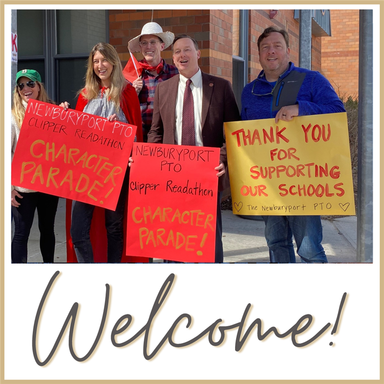 Parents and teachers holding signs at book character parade